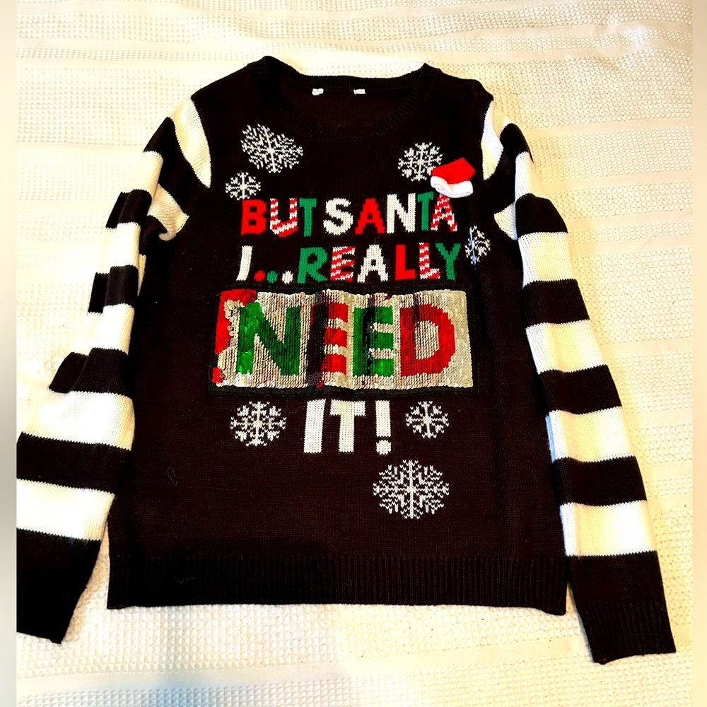 Ugly Christmas Sweater worn once. Sequined letters change reflecting want/need.